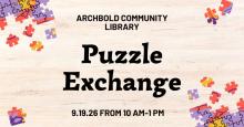 Jigsaw puzzle pieces cover a table